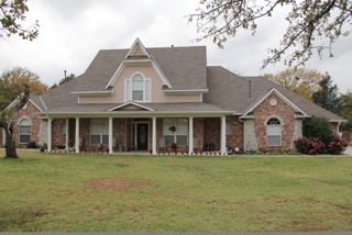 Two-story residential home roofing project in OK