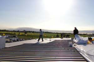 Group of Coryell roofers working on commercial roofing project